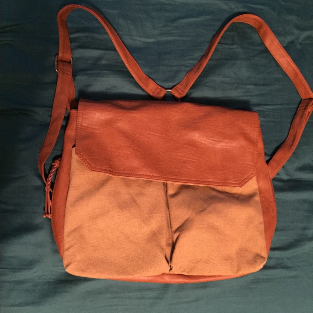 Canvas backpack with leather accents